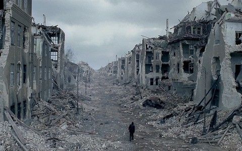Manwalkingthroughdestroyedcity.jpg