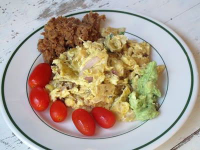 garlic,red onion,tortilla chips,eggs,refried beans,guacamole,grape tomatoes